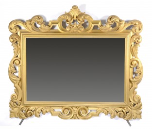 MIRROR IN A CARVED FRAME