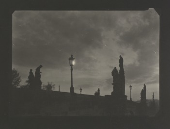 Charles Bridge (by night) / Sculptures on Charles Bridge with a lamp [Josef Sudek (1896-1976)]