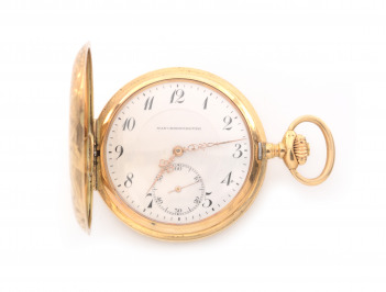 Gold pocket watch with poppies