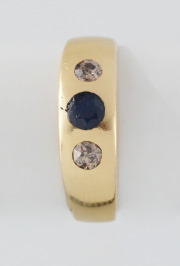 Gold Ring with Diamonds and a Sapphire