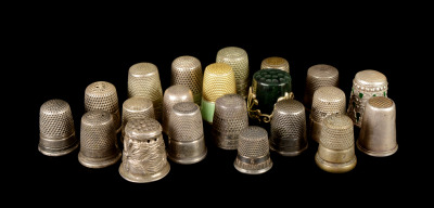 A collection of silver thimbles